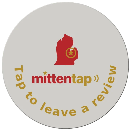 Coaster back: the Mitten Tap Michigan logo with 'Tap to leave a review' curved along the bottom